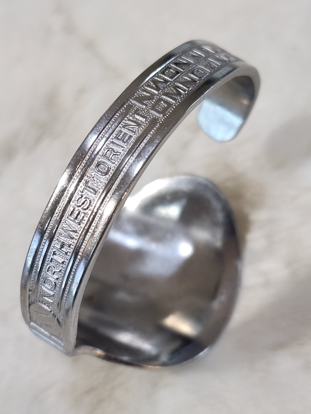 Stamped Silver Tone Cuff Bracelet with 'Northwest Orient' Detail